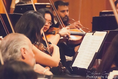 Violinists playing with the Riverside Opera Company